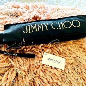 NWT one touch Jimmy Choo Umbrella , with pouch and monogram inside .